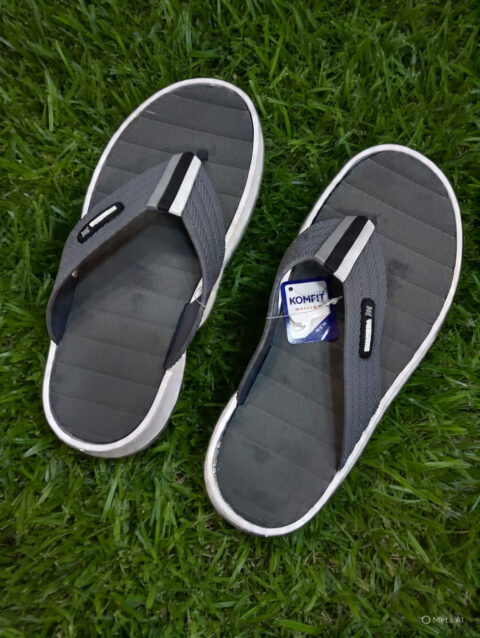 Grey Outdoor Sandals on Fresh Green Grass